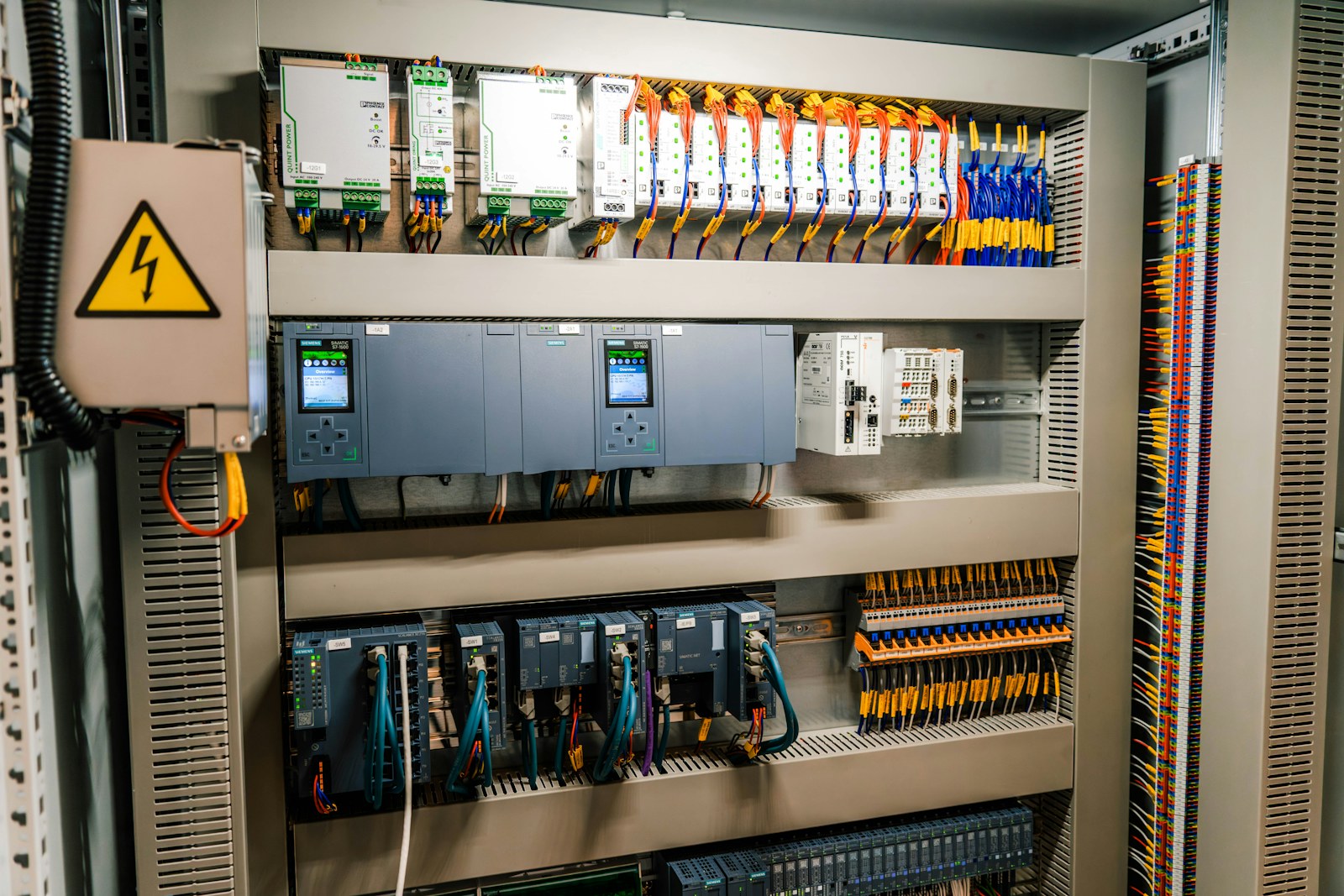 Industrial automation control panel with PLC and interface wiring